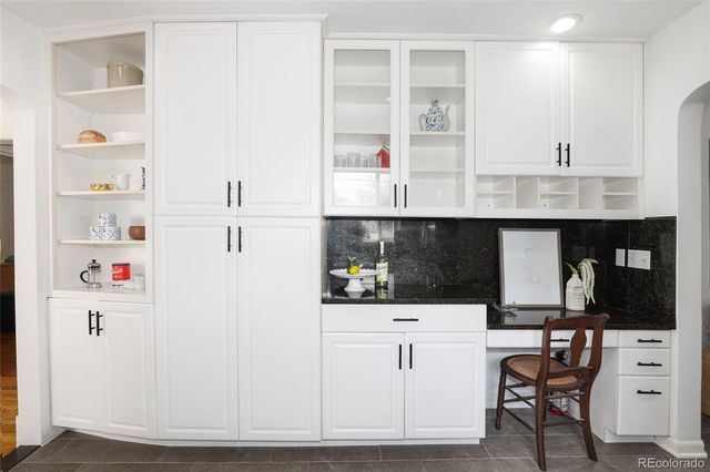 a kitchen with stainless steel appliances cabinets and a refrigerator
