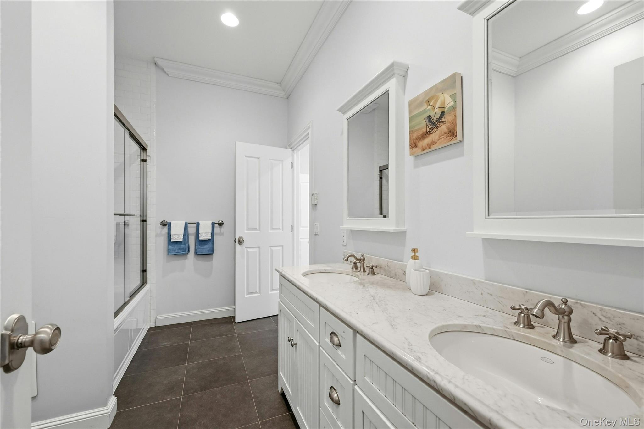5 Mill Road Lloyd Harbor, NY 11743 - Photo 33 of 49 a spacious bathroom with a granite countertop sink mirror and vanity