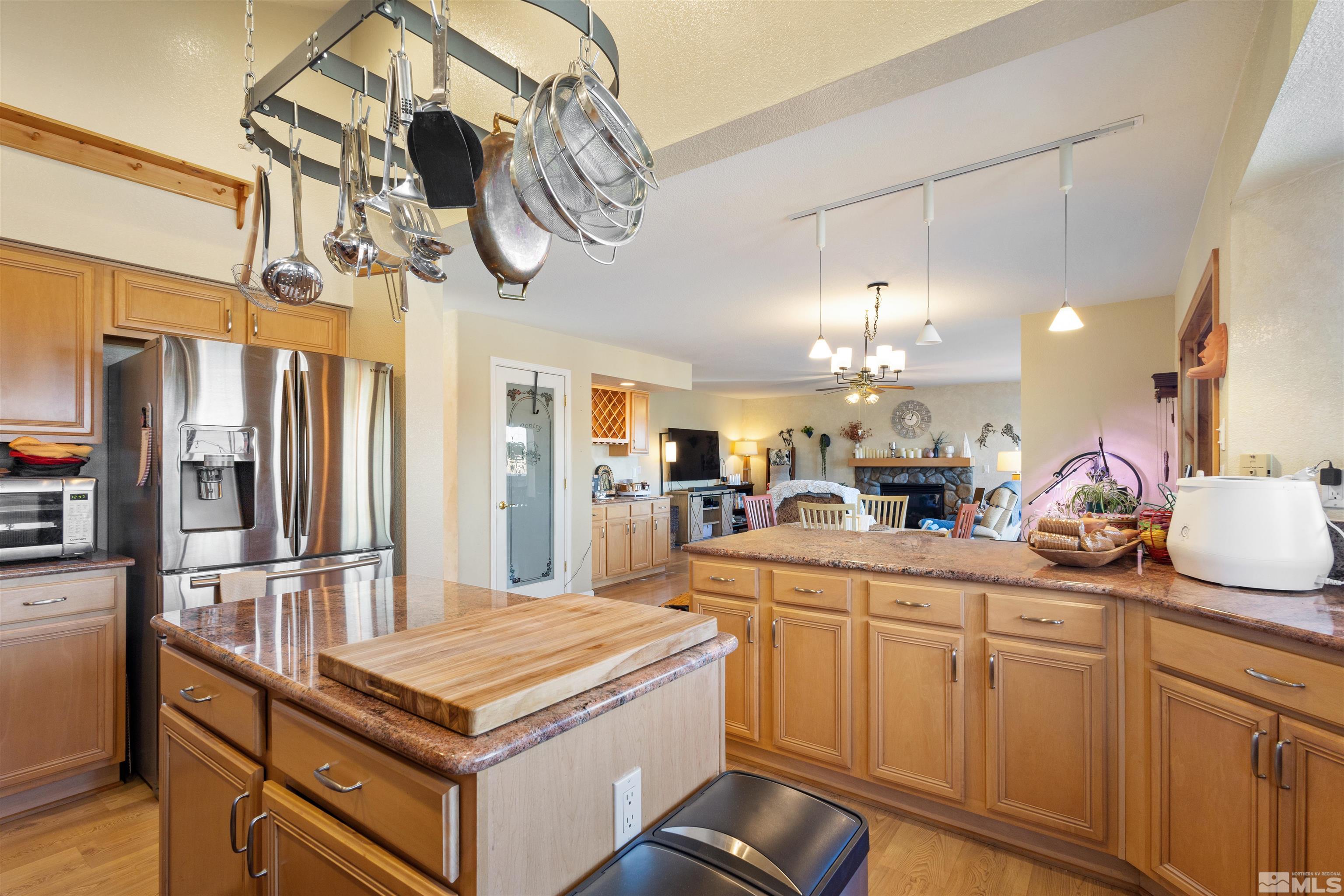 608 Sugar Tree Court Reno, NV 89511 - Photo 12 of 40 a kitchen with stainless steel appliances a sink stove and refrigerator