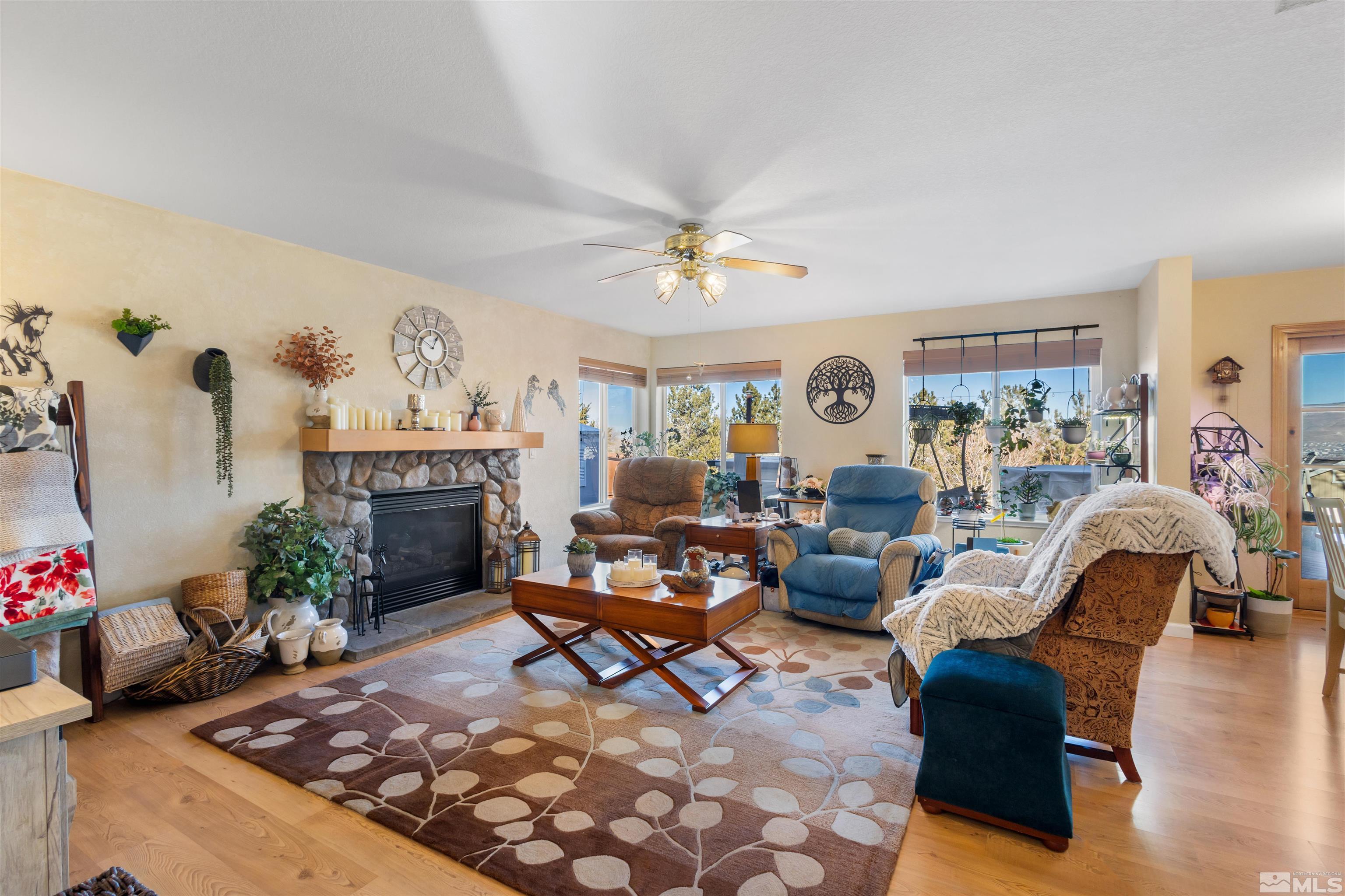 608 Sugar Tree Court Reno, NV 89511 - Photo 14 of 40 a living room with furniture and a fireplace