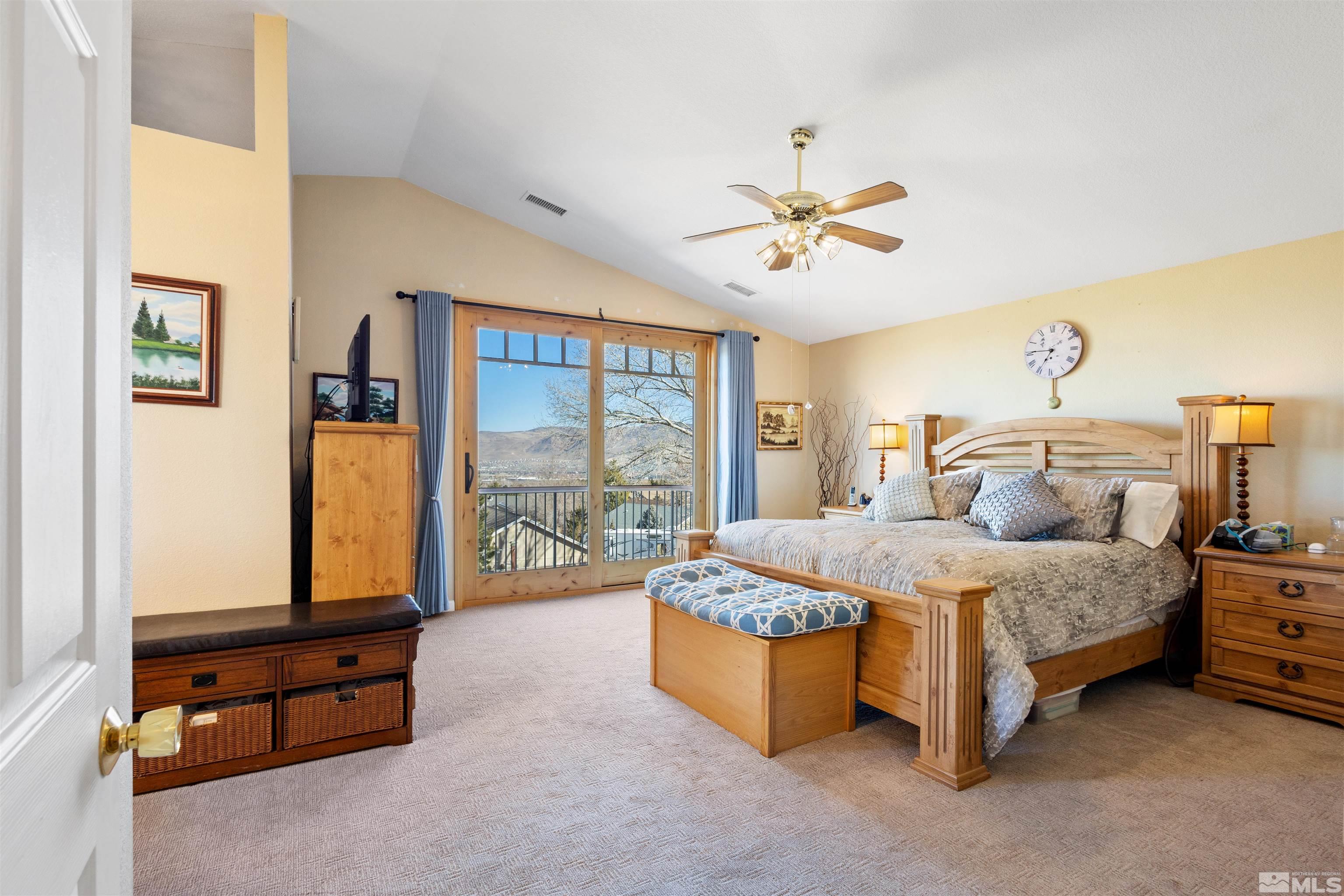 608 Sugar Tree Court Reno, NV 89511 - Photo 23 of 40 a spacious bedroom with a bed and large windows
