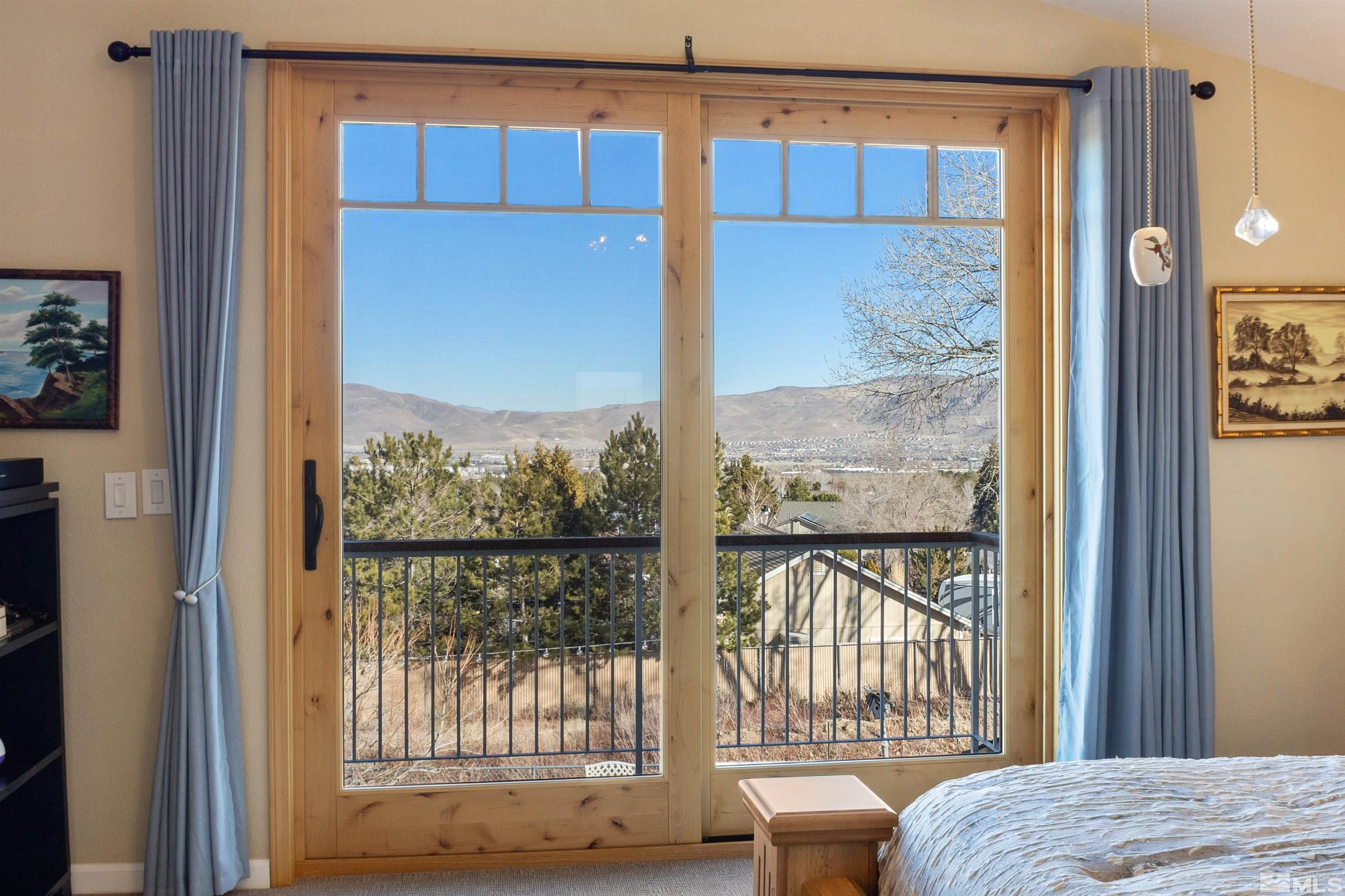 608 Sugar Tree Court Reno, NV 89511 - Photo 24 of 40 a view of a bedroom with furniture and windows