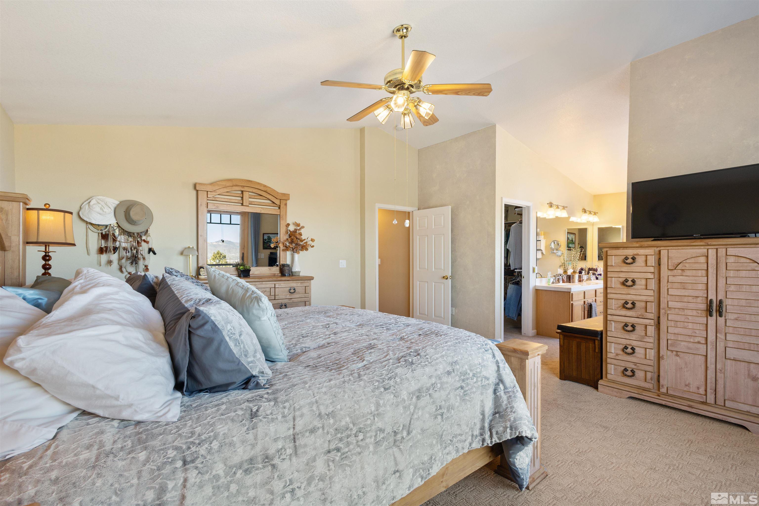 608 Sugar Tree Court Reno, NV 89511 - Photo 25 of 40 a bedroom with a bed and dresser
