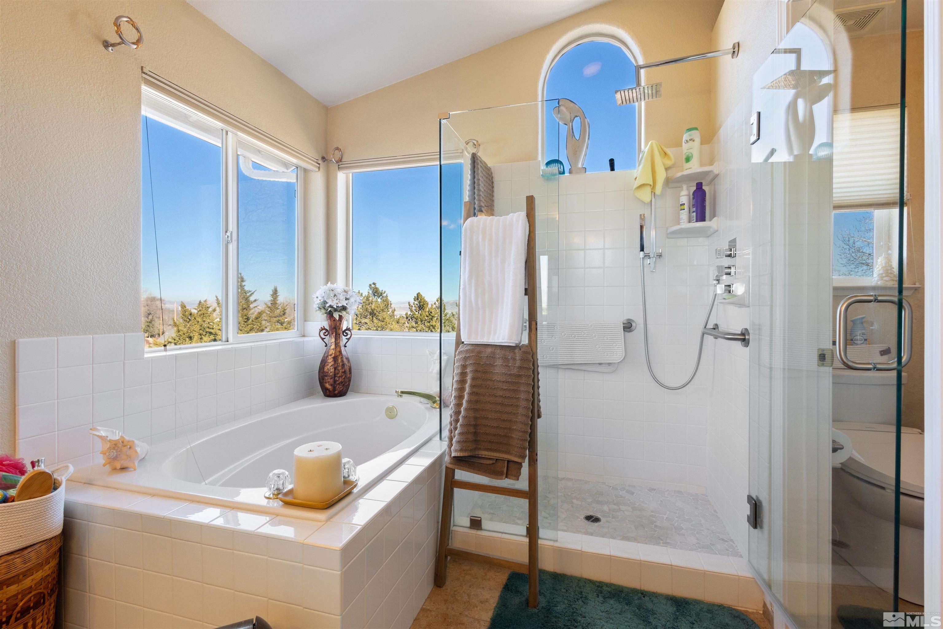 608 Sugar Tree Court Reno, NV 89511 - Photo 27 of 40 a bathroom with a tub sink and mirror