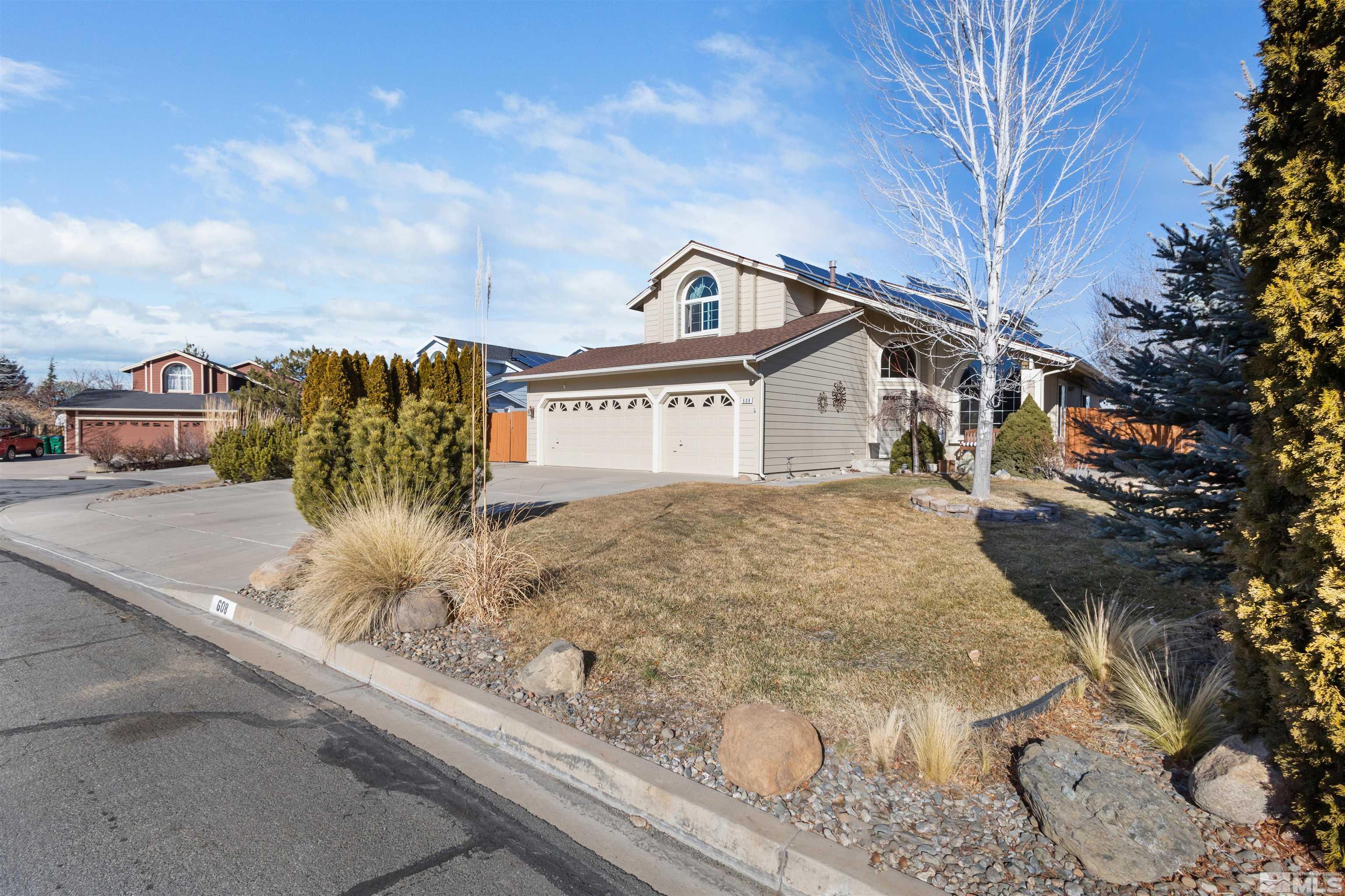 608 Sugar Tree Court Reno, NV 89511 - Photo 3 of 40 a front view of a house with a yard