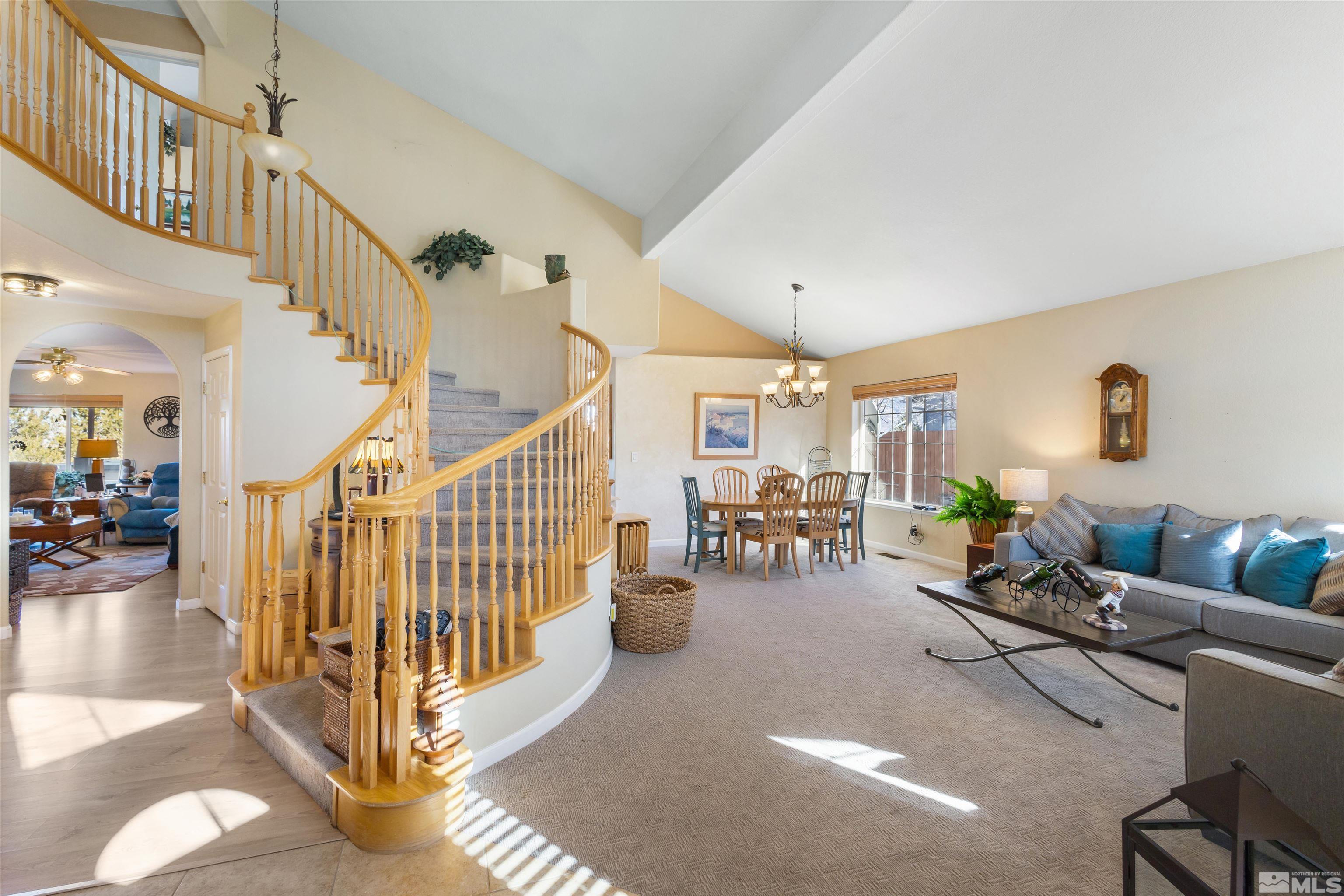 608 Sugar Tree Court Reno, NV 89511 - Photo 5 of 40 a living room with furniture and a chandelier