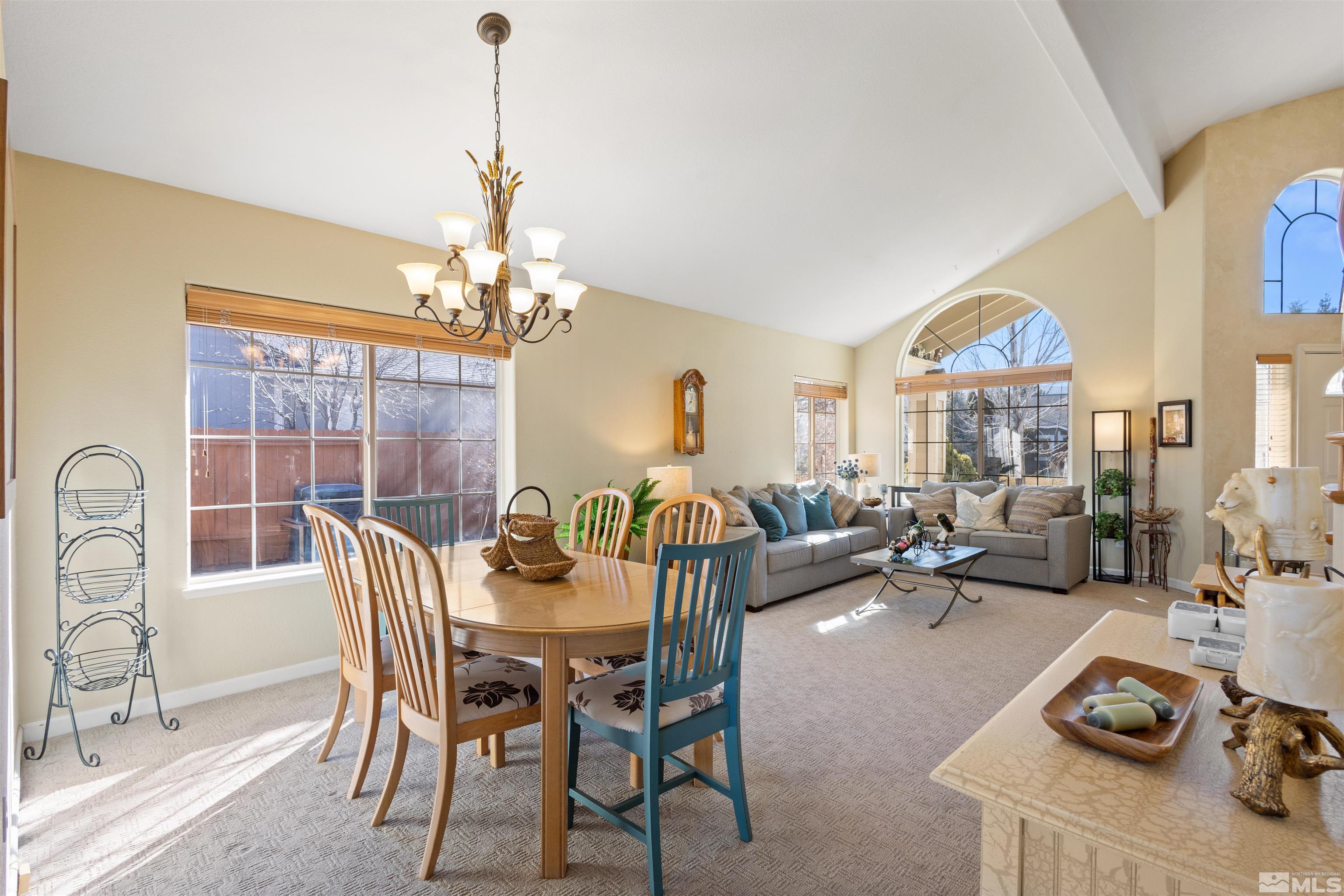 608 Sugar Tree Court Reno, NV 89511 - Photo 8 of 40 a dining room with furniture a chandelier and window