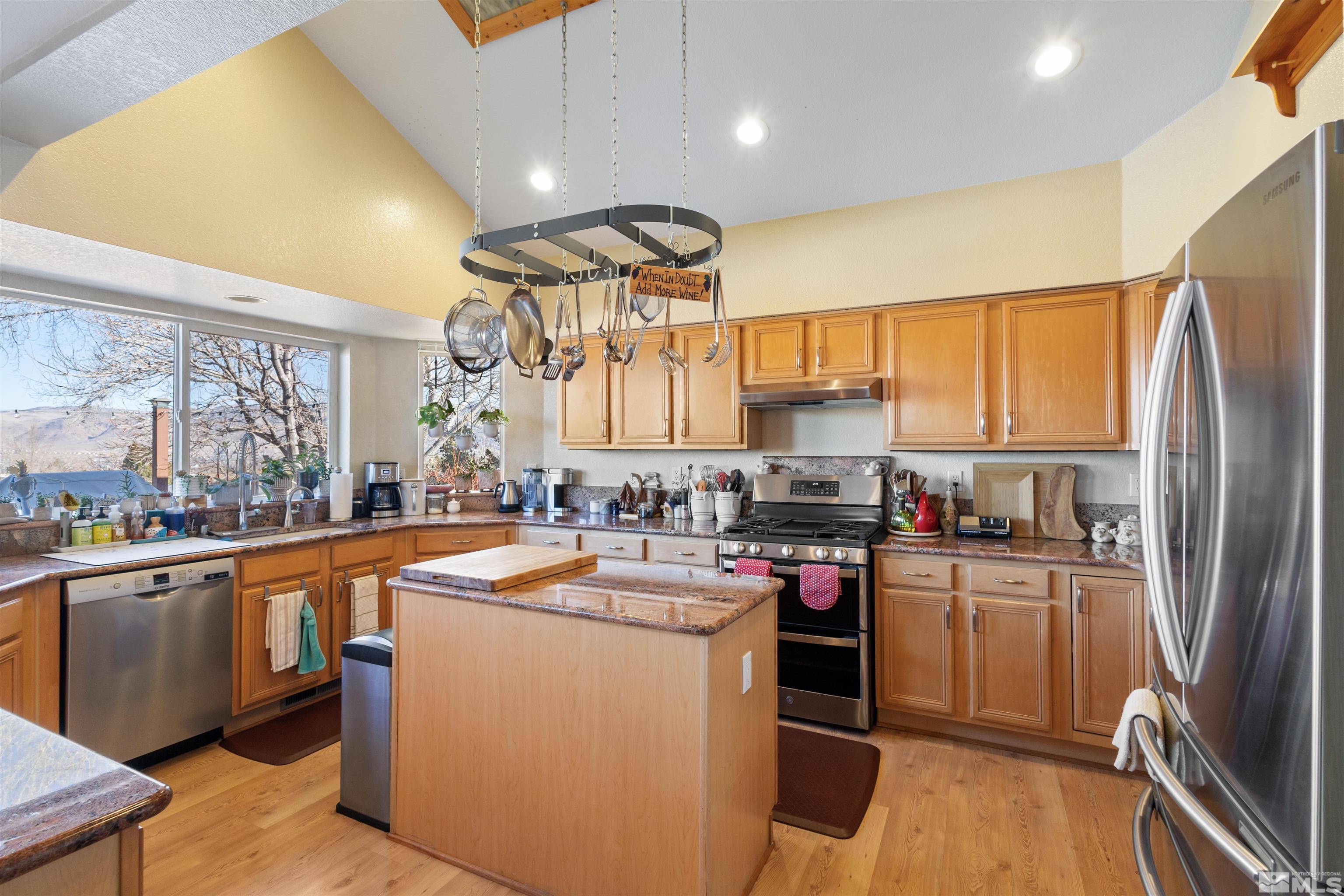 608 Sugar Tree Court Reno, NV 89511 - Photo 10 of 40 a kitchen with a sink appliances cabinets and a counter top space