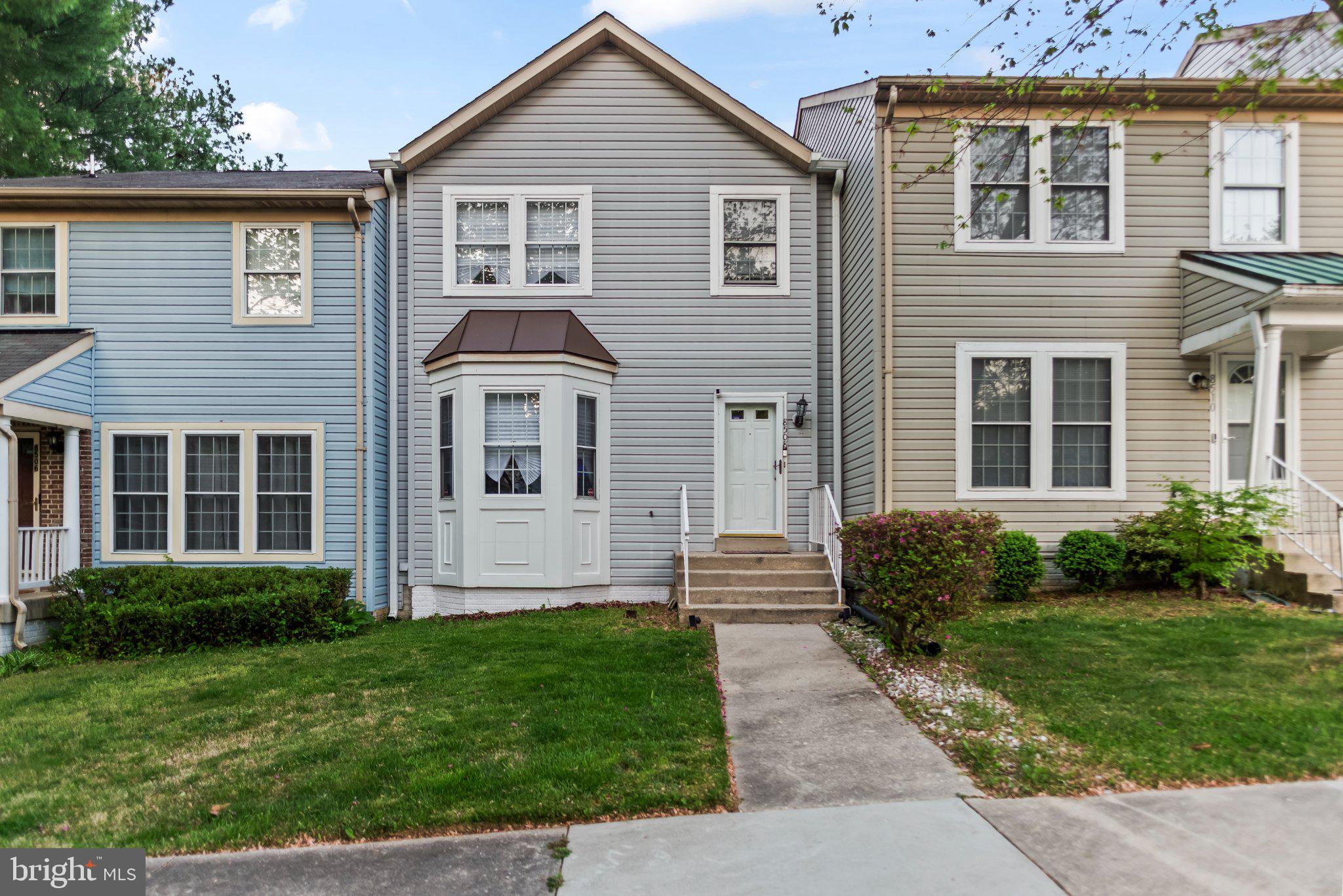 Charming townhouse with inviting entrance.