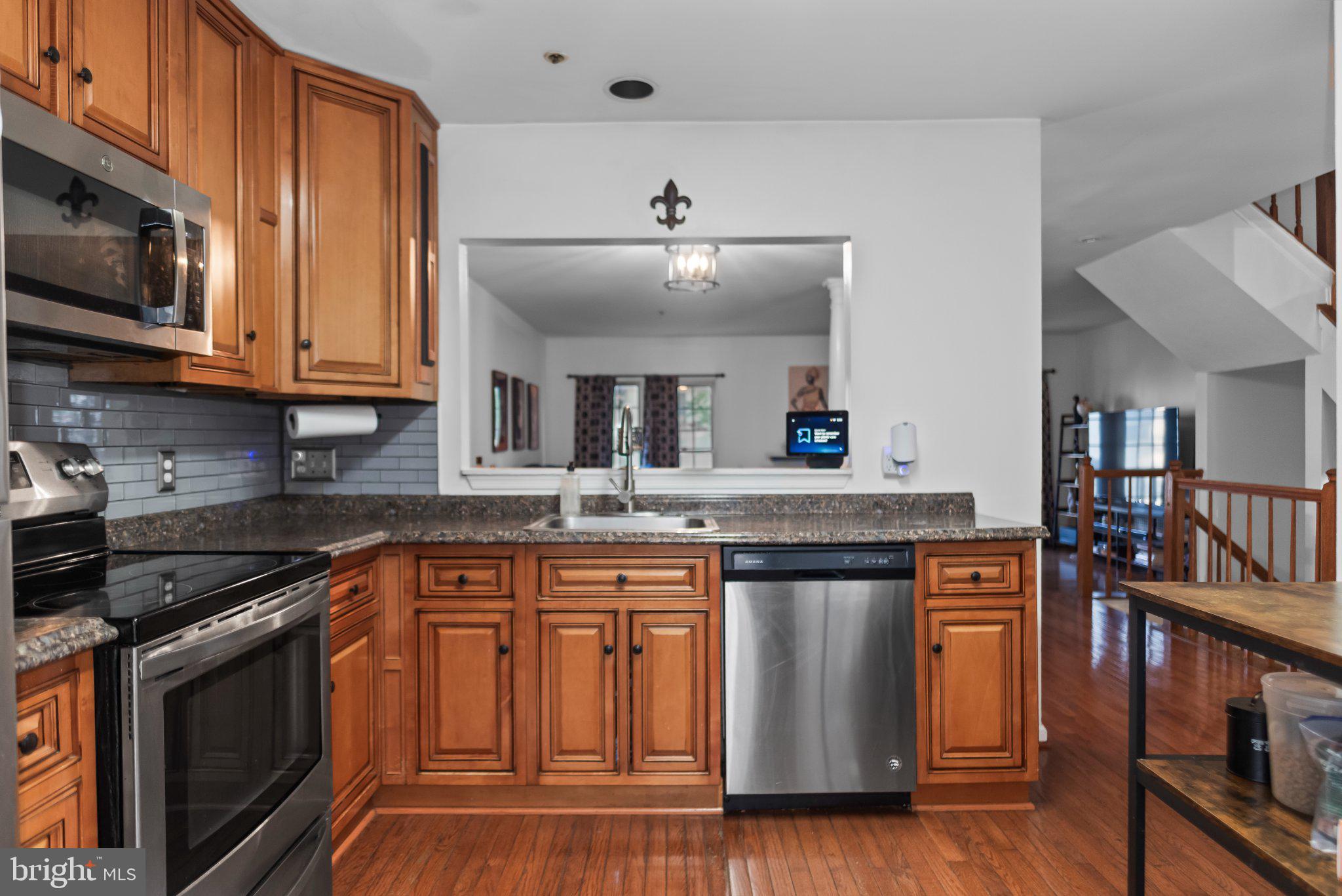 8508 Rheims Court Upper Marlboro, MD 20772 - Photo 11 of 28 Warm wood tones in a modern kitchen.