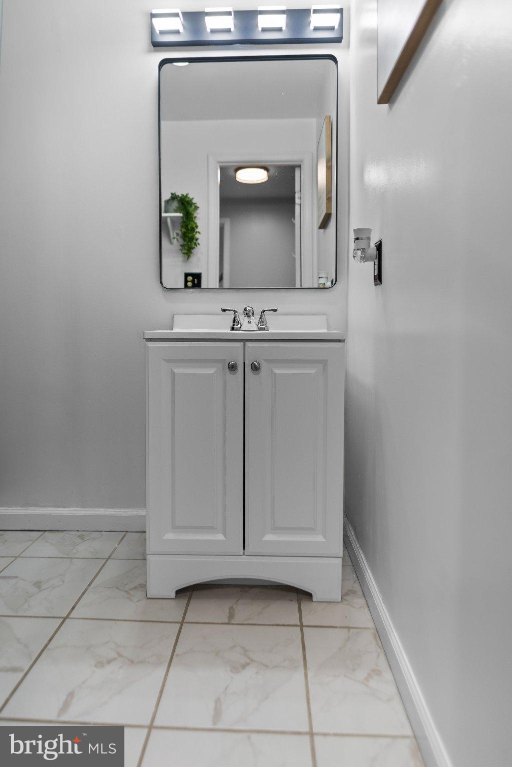 8508 Rheims Court Upper Marlboro, MD 20772 - Photo 25 of 28 Sleek modern bathroom elegance.