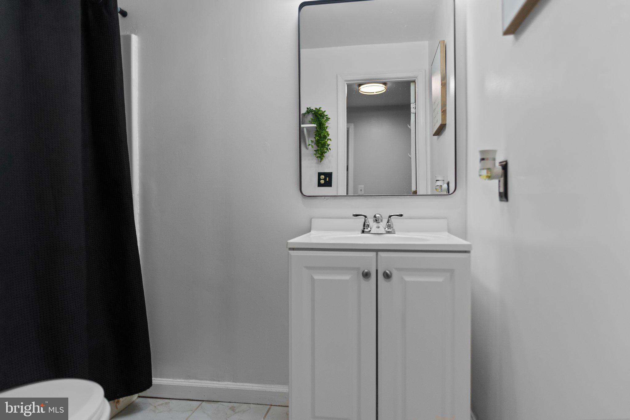 8508 Rheims Court Upper Marlboro, MD 20772 - Photo 26 of 28 Sleek bathroom with modern elegance.