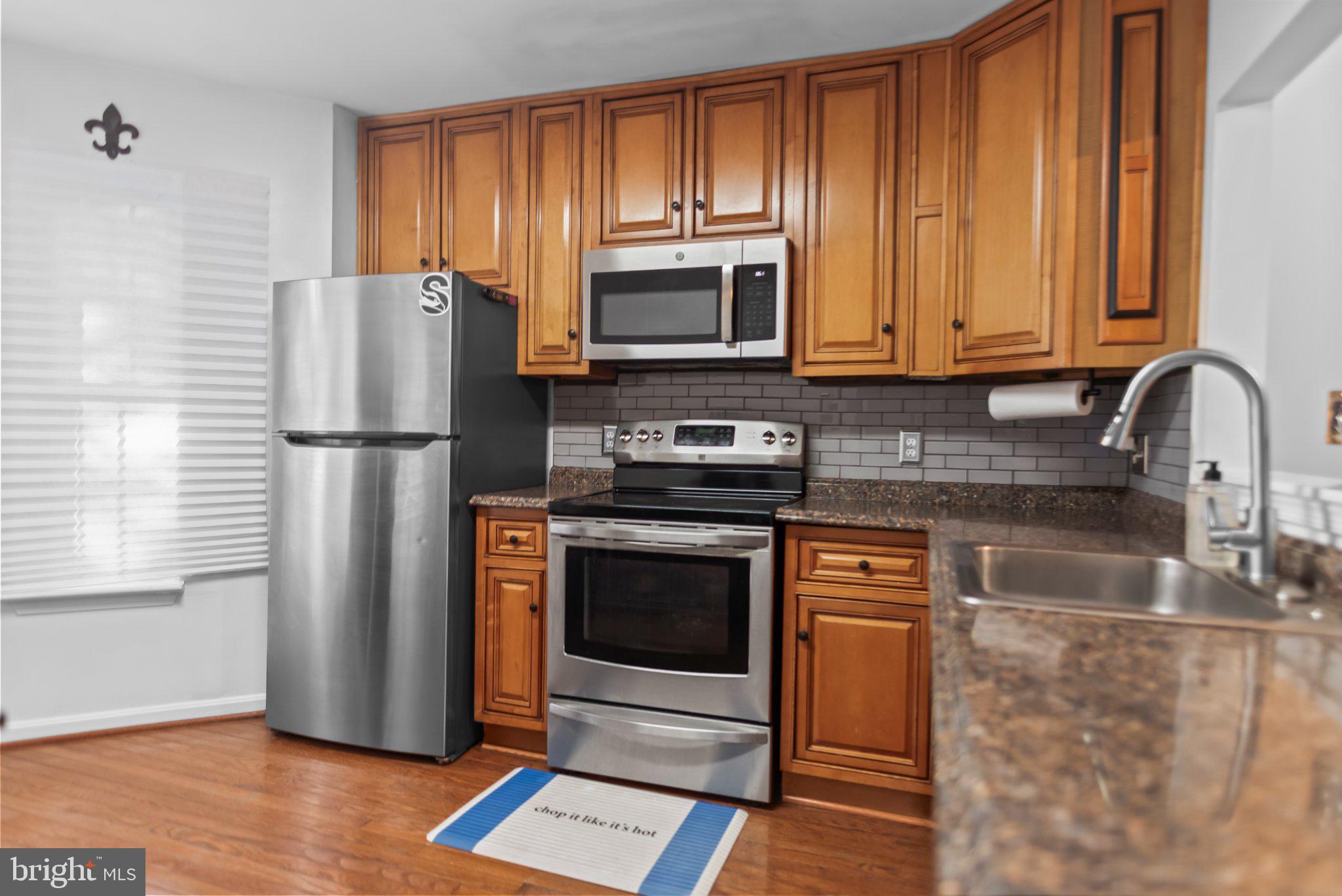 8508 Rheims Court Upper Marlboro, MD 20772 - Photo 10 of 28 Modern kitchen with warm wood tones.