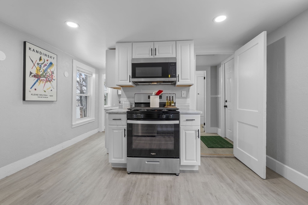 15 Reservoir Street Worcester, MA 01605 - Photo 11 of 35 a kitchen with microwave and cabinets