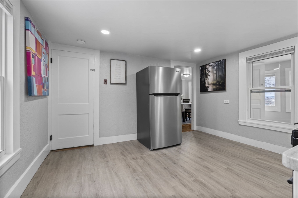 15 Reservoir Street Worcester, MA 01605 - Photo 17 of 35 a view of kitchen with refrigerator and wooden floor