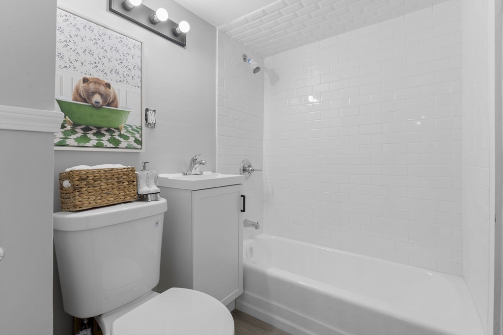 15 Reservoir Street Worcester, MA 01605 - Photo 18 of 35 a bathroom with a sink toilet and bathtub