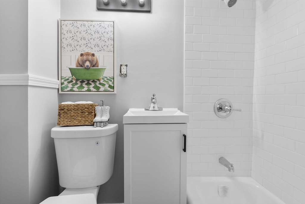 15 Reservoir Street Worcester, MA 01605 - Photo 19 of 35 a bathroom with a toilet a sink and bathtub