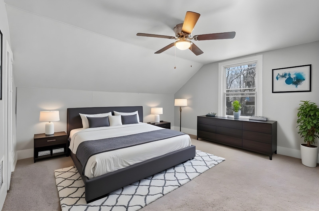 15 Reservoir Street Worcester, MA 01605 - Photo 24 of 35 a bedroom with a bed and ceiling fan