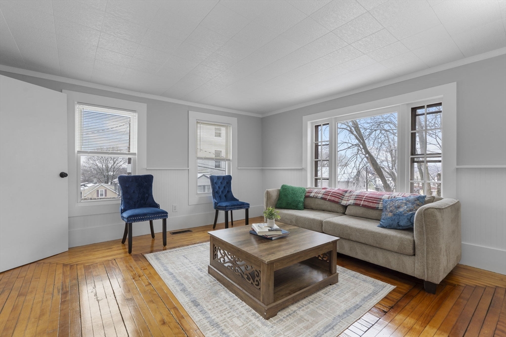 15 Reservoir Street Worcester, MA 01605 - Photo 4 of 35 a living room with furniture and a window