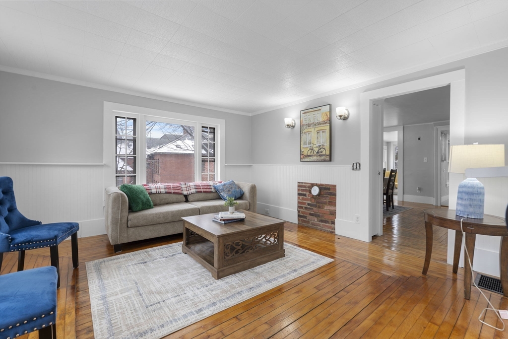 15 Reservoir Street Worcester, MA 01605 - Photo 5 of 35 a living room with furniture and a wooden floor