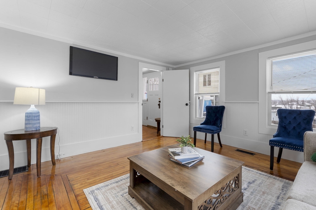 15 Reservoir Street Worcester, MA 01605 - Photo 6 of 35 a living room with furniture and a wooden floor