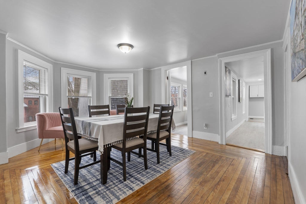 15 Reservoir Street Worcester, MA 01605 - Photo 9 of 35 a view of a dining room with furniture and wooden floor