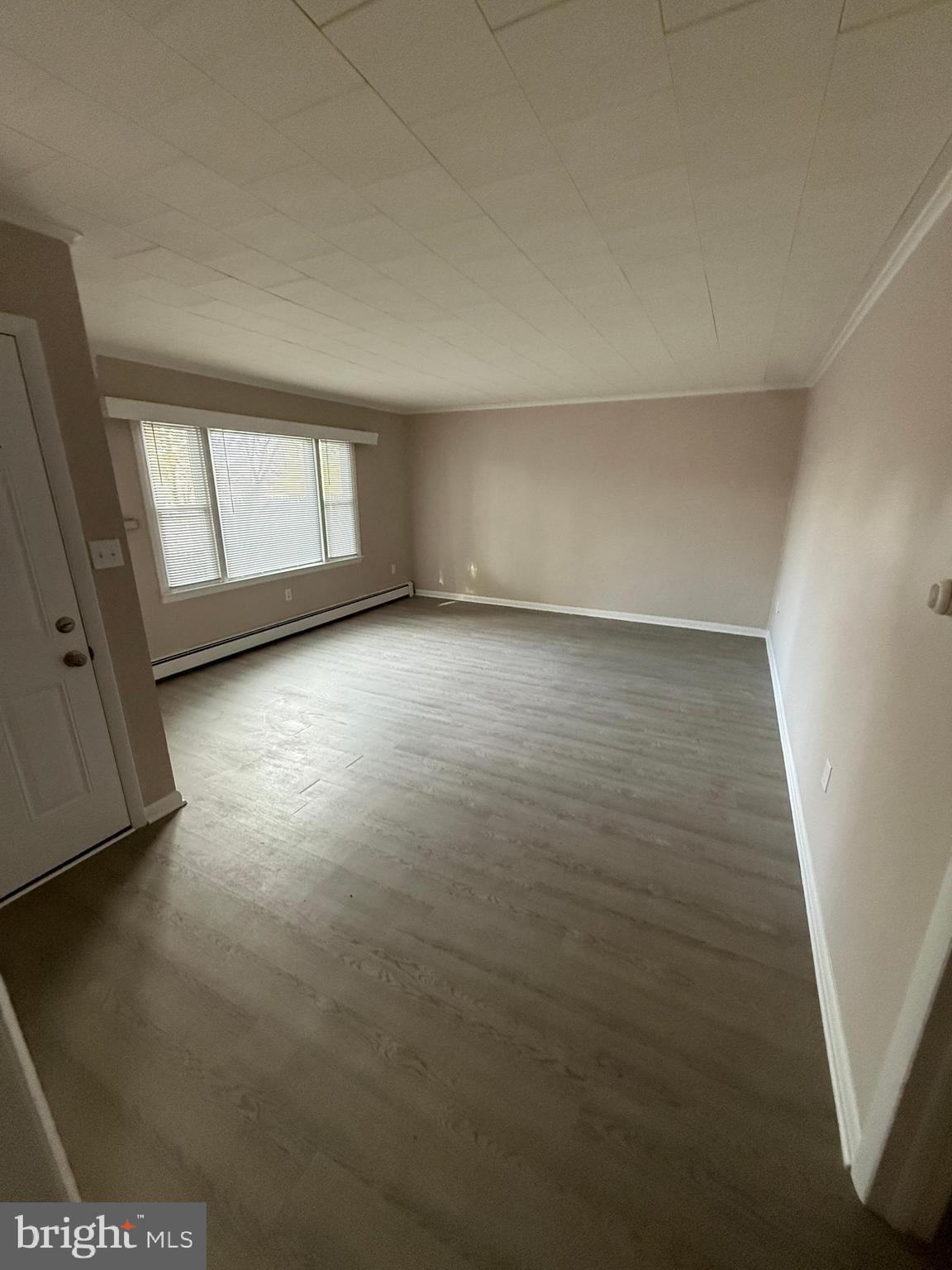 304 Walnut Street, Unit B Waynesboro, PA 17268 - Photo 8 of 17 an empty room with windows