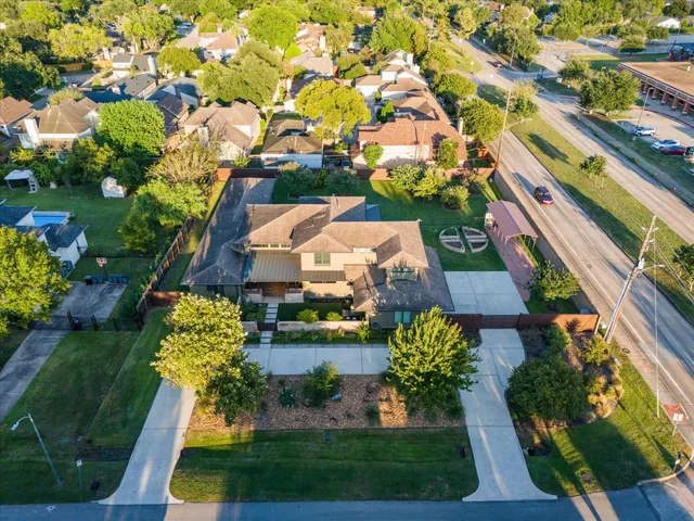 an aerial view of a house with a garden