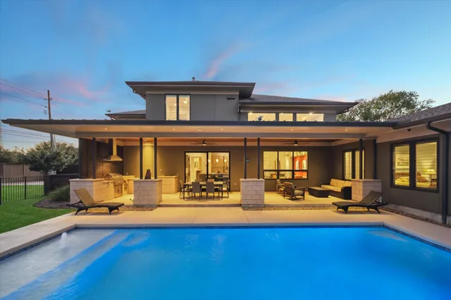 a view of swimming pool with outdoor seating