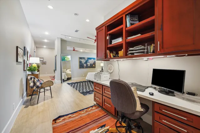 a workspace with furniture and wooden floor