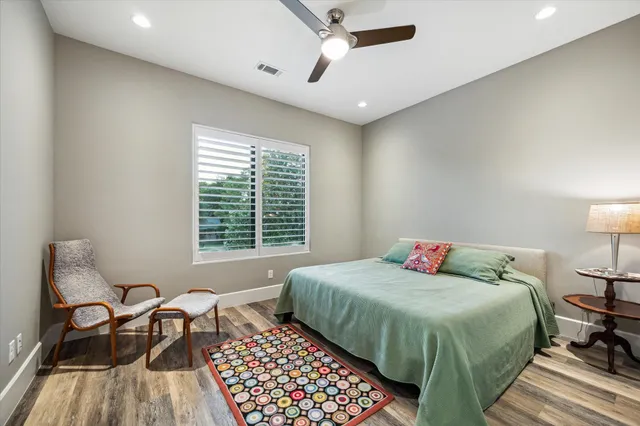 a bedroom with a bed and chair