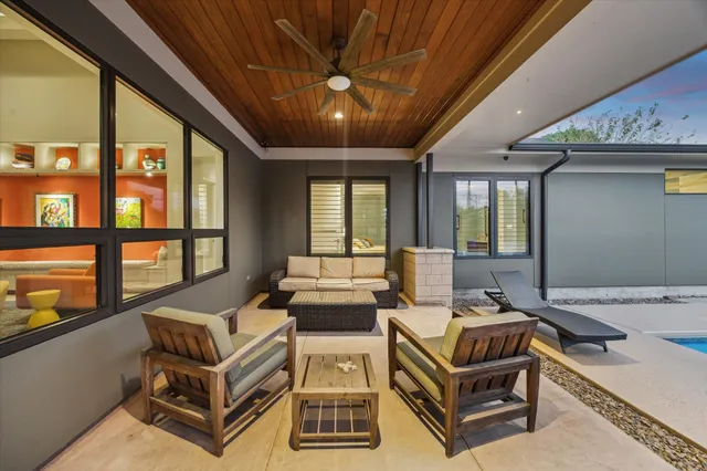 a living room with furniture and a large window