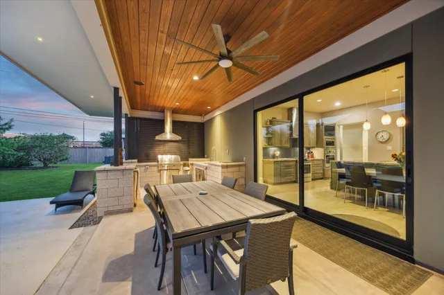 a patio with table and chairs