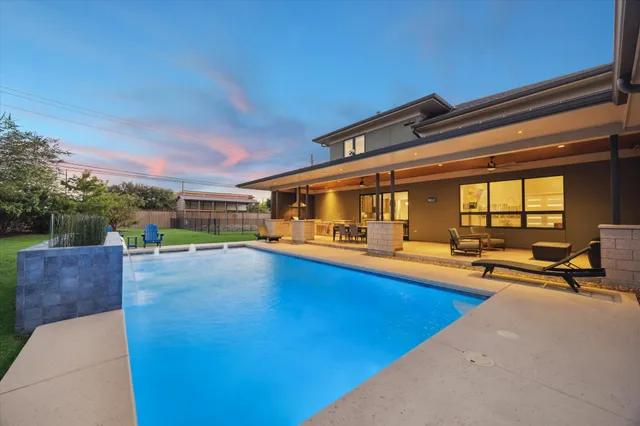a front view of a house with a yard table and chairs