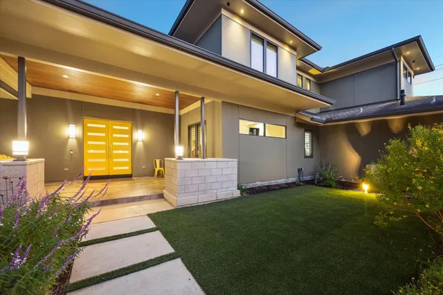a front view of a house with garden