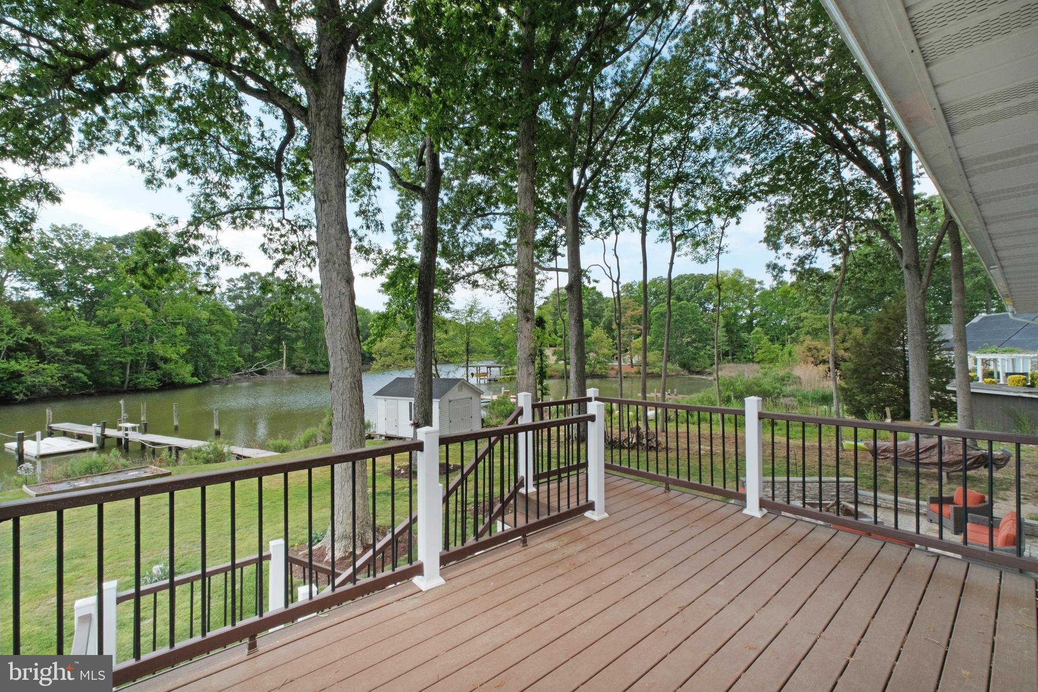 819 Elm Drive West River, MD 20778 - Photo 14 of 39 a view of a wooden deck with a large trees