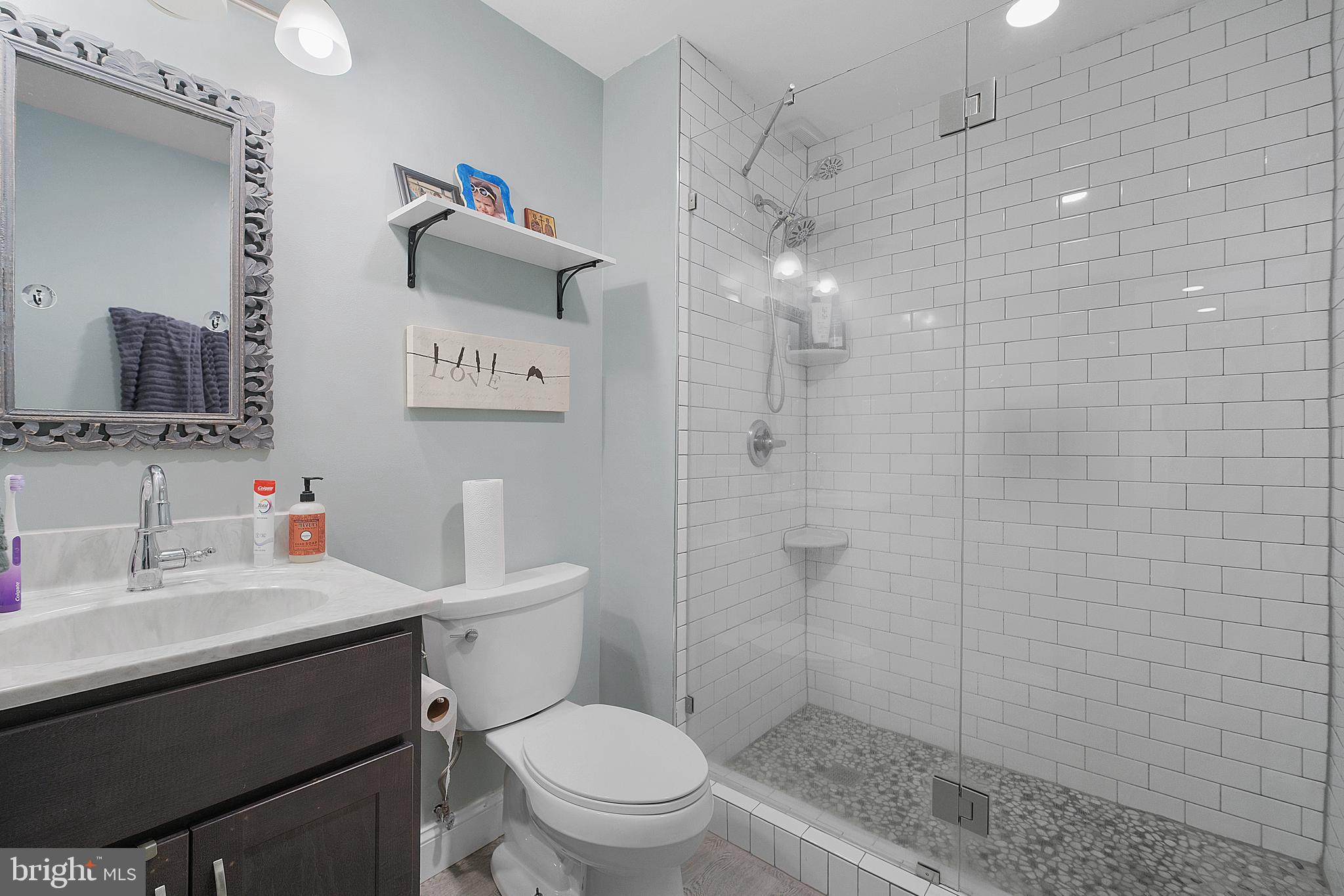 819 Elm Drive West River, MD 20778 - Photo 17 of 39 a bathroom with a sink toilet and shower