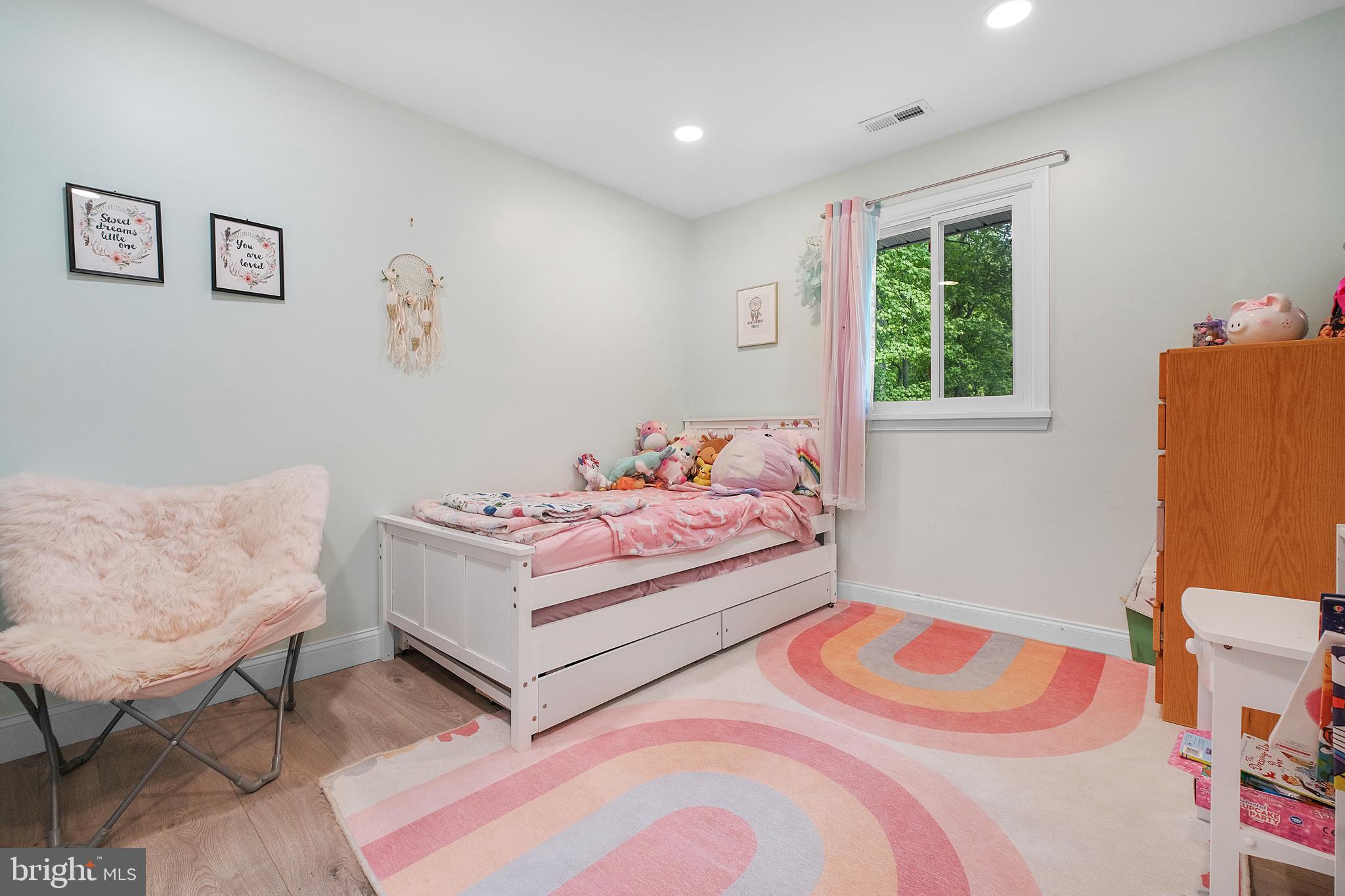 819 Elm Drive West River, MD 20778 - Photo 18 of 39 a bedroom with a bed and a couch