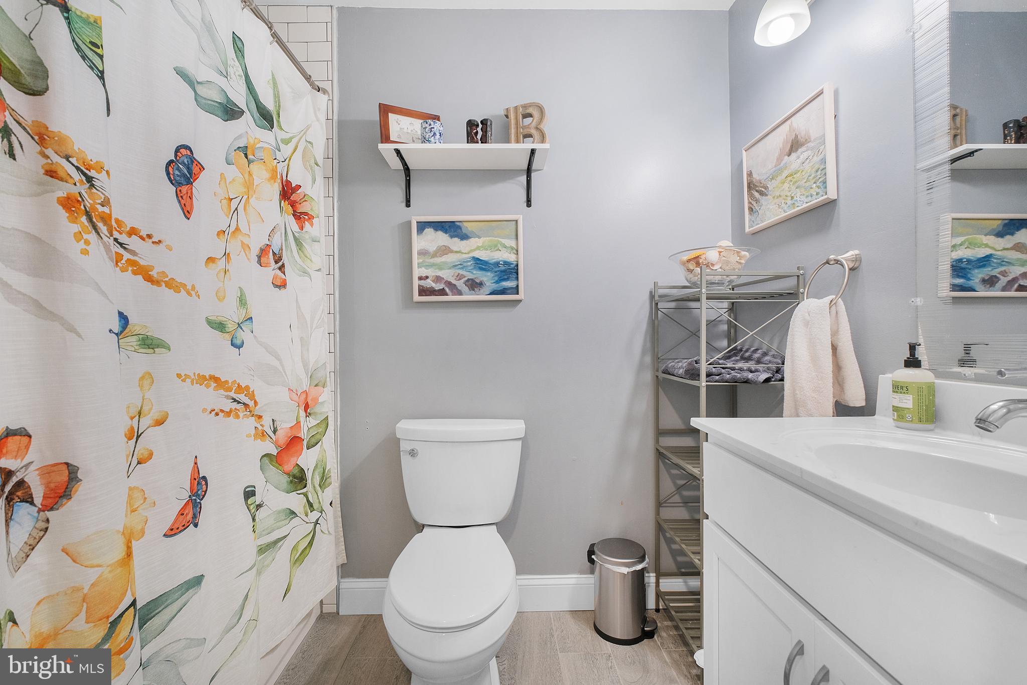 819 Elm Drive West River, MD 20778 - Photo 20 of 39 a bathroom with a toilet and a sink a toilet curtain