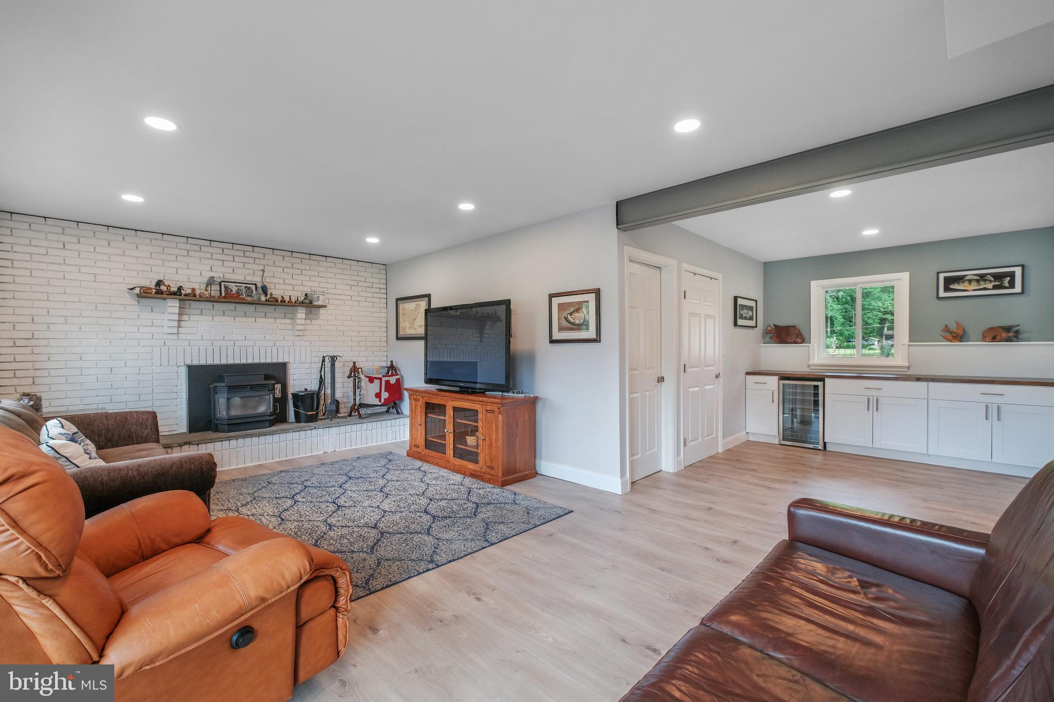 819 Elm Drive West River, MD 20778 - Photo 25 of 39 a living room with furniture flat screen tv and a fireplace