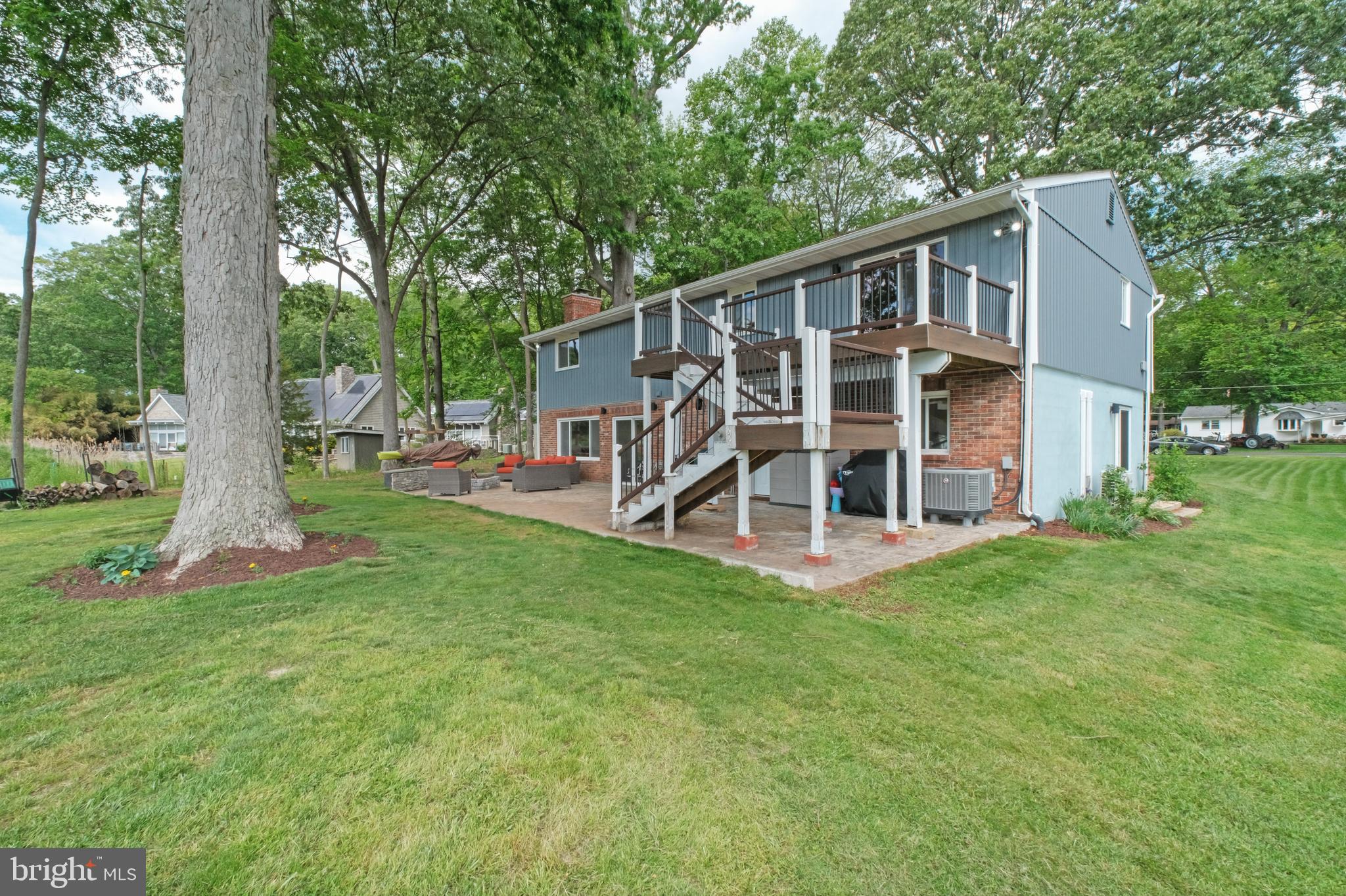 819 Elm Drive West River, MD 20778 - Photo 30 of 39 a view of a house with backyard and a tree