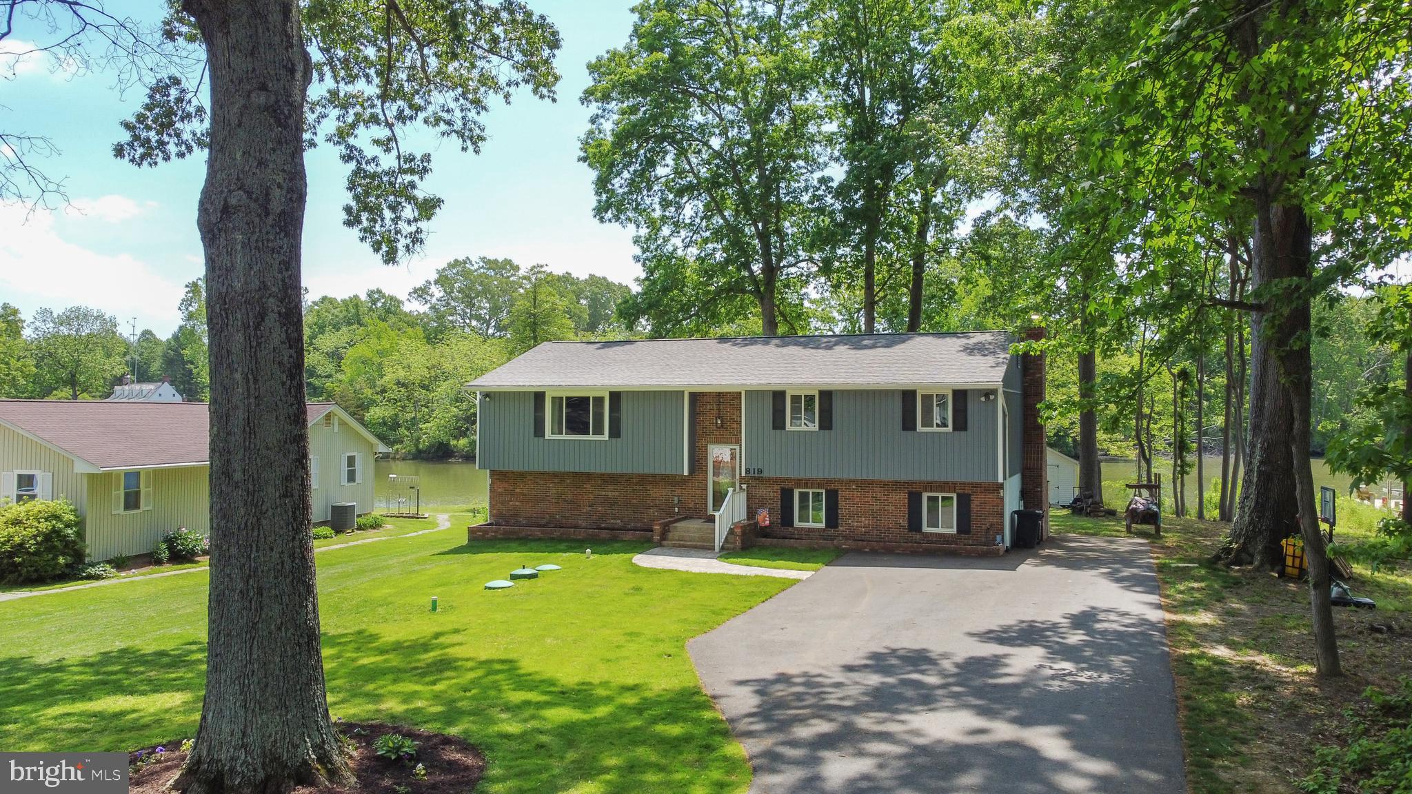 819 Elm Drive West River, MD 20778 - Photo 3 of 39 a view of a house with a yard and tree s