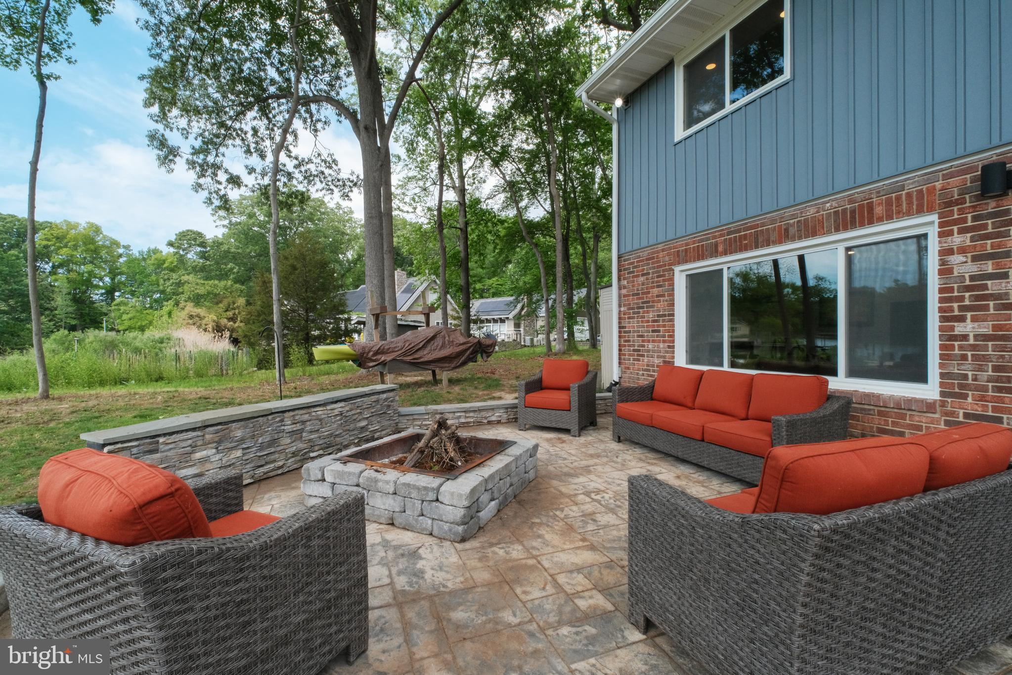 819 Elm Drive West River, MD 20778 - Photo 33 of 39 a view of a backyard with couches plants and large tree