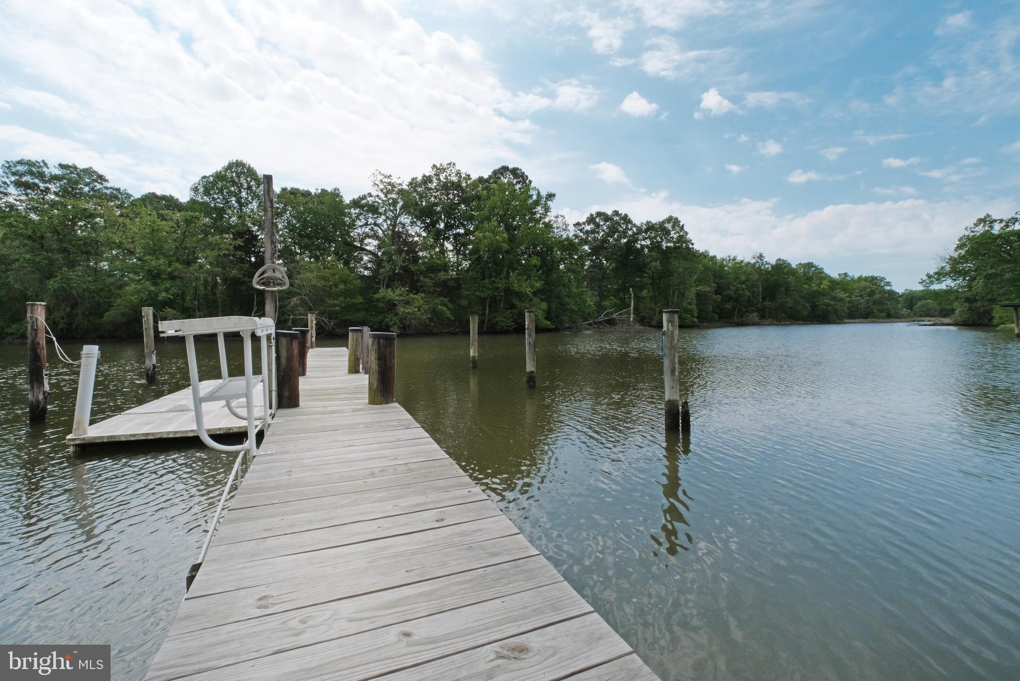 819 Elm Drive West River, MD 20778 - Photo 38 of 39 a wooden pier with boats in a lake