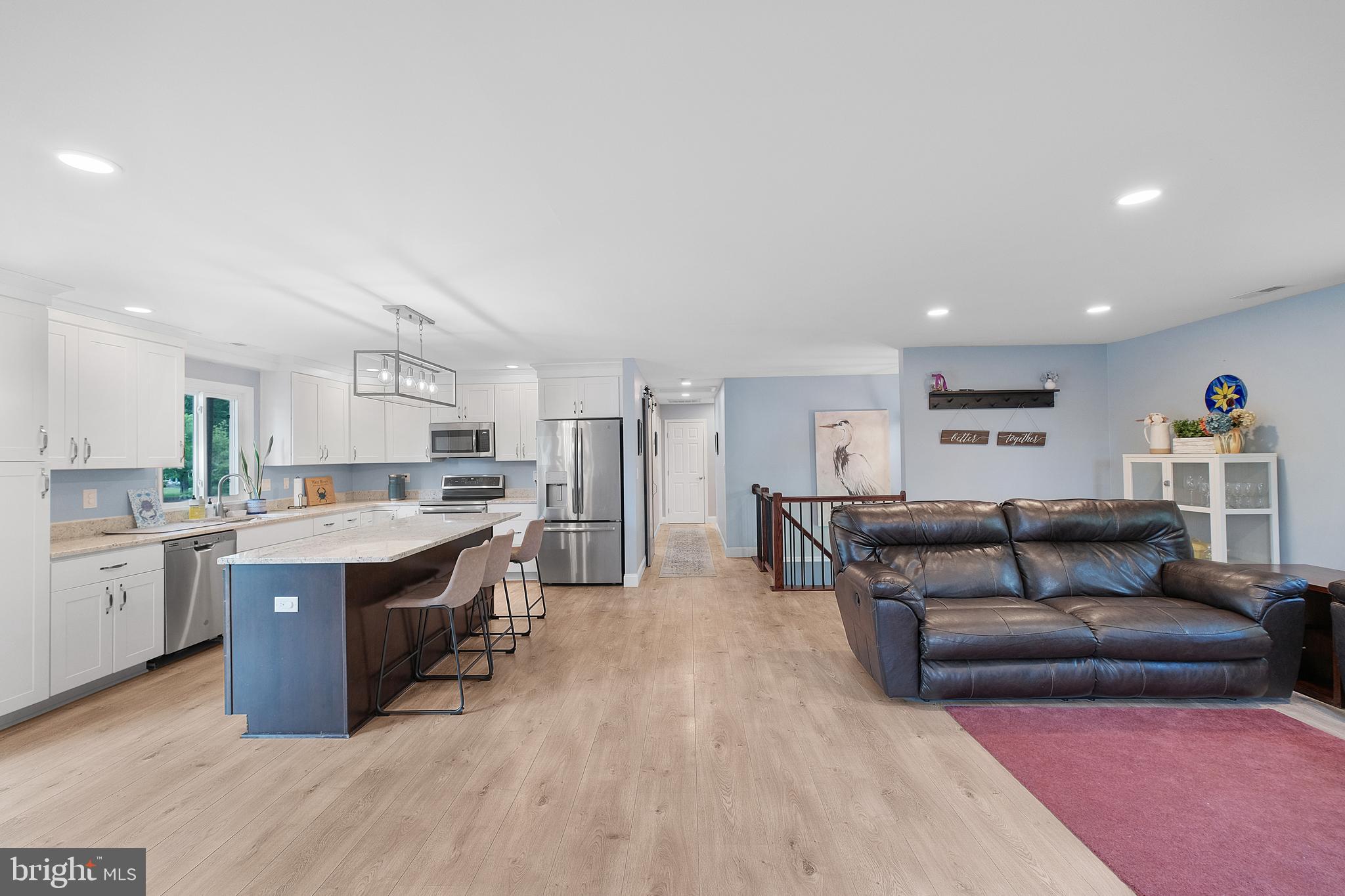 819 Elm Drive West River, MD 20778 - Photo 5 of 39 a large living room with stainless steel appliances granite countertop a couch and a view of kitchen