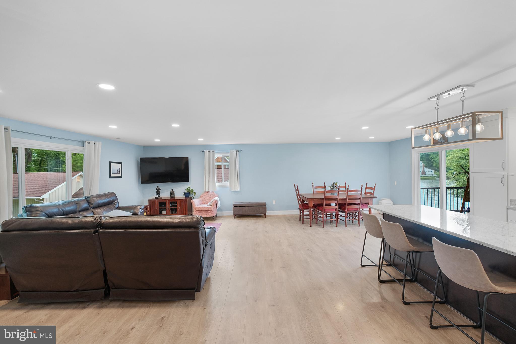 819 Elm Drive West River, MD 20778 - Photo 9 of 39 a living room with furniture a flat screen tv and a large window