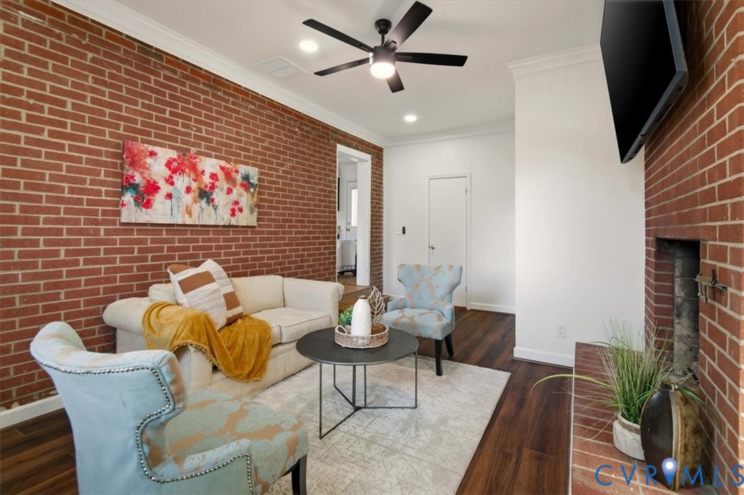 2720 Omega Road Henrico, VA 23228 - Photo 21 of 45 Den featuring brick wall, crown molding, LVP fl