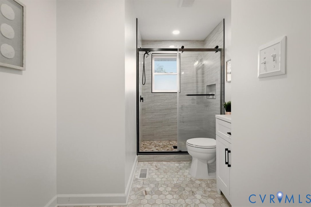 2720 Omega Road Henrico, VA 23228 - Photo 38 of 45 Full bathroom with new vanity, new shower, and lig