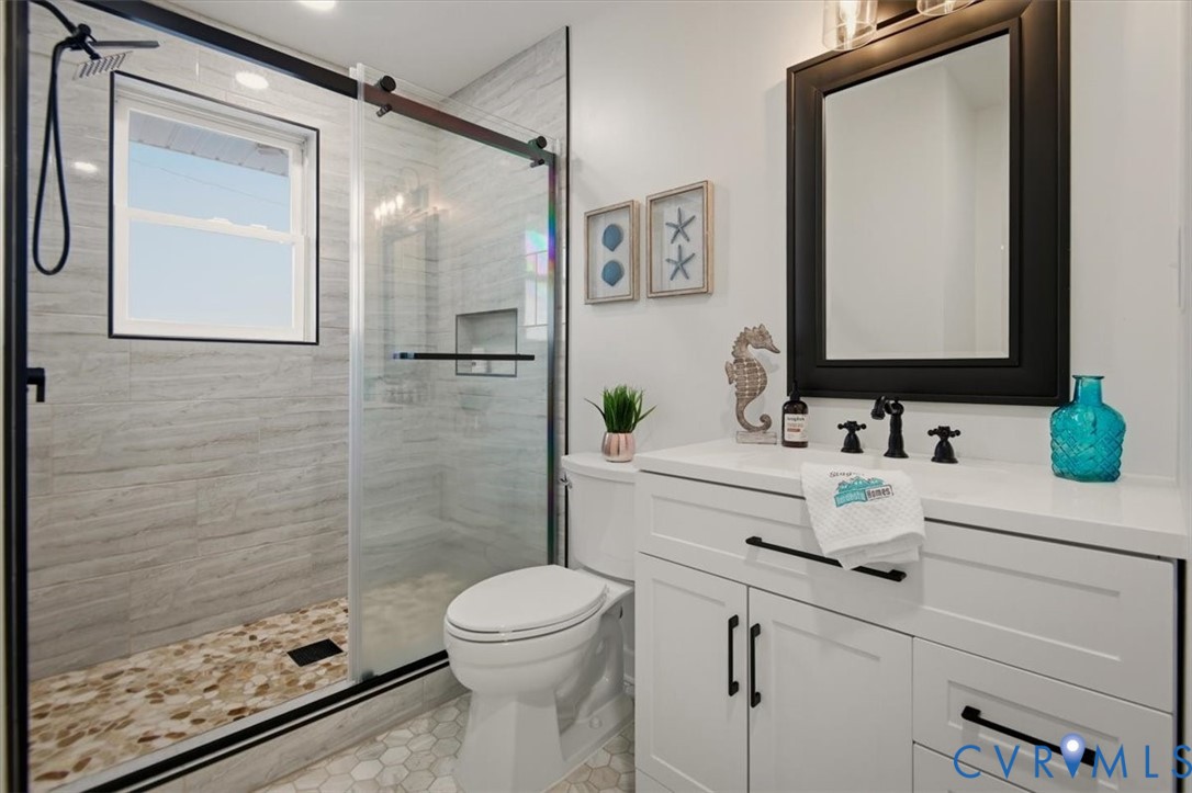 2720 Omega Road Henrico, VA 23228 - Photo 39 of 45 Bathroom featuring new vanity and a tile shower