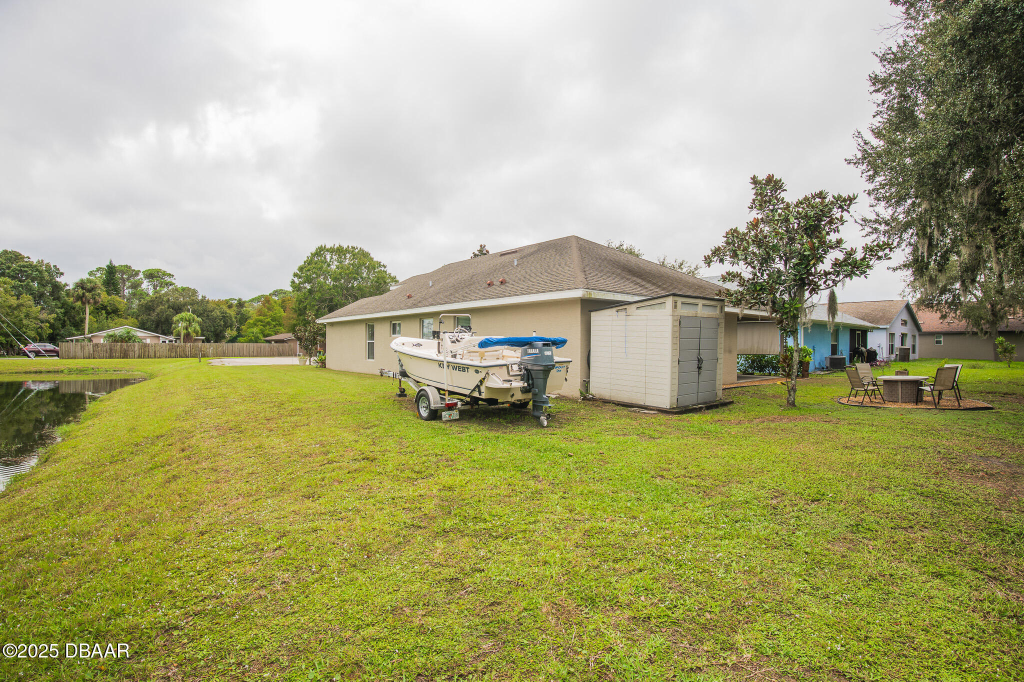 801 Angelina Court Ponce Inlet, FL 32127 - Photo 22 of 23 Side back